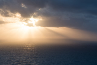 Sun and Clouds Smoothing the Sea