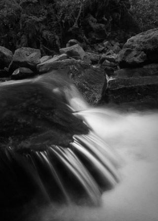 Rushing Stream Over Dark Rocks