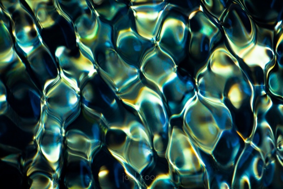 Flowing Water Creating Diamond Light Patterns