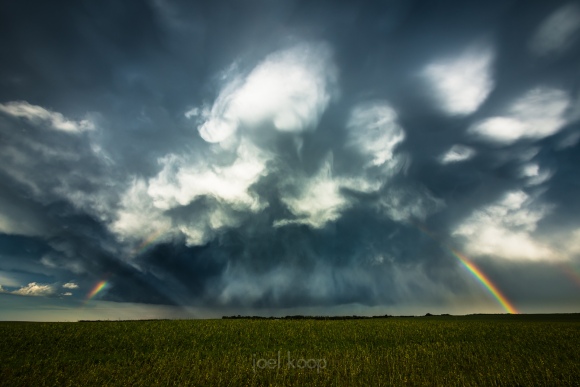 storm-and-rainbow-over-canola-field