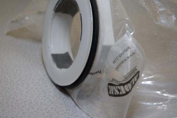 Plexi-glass, drain, rubber washer, plastic bag, cardboard washer, inside drain piece